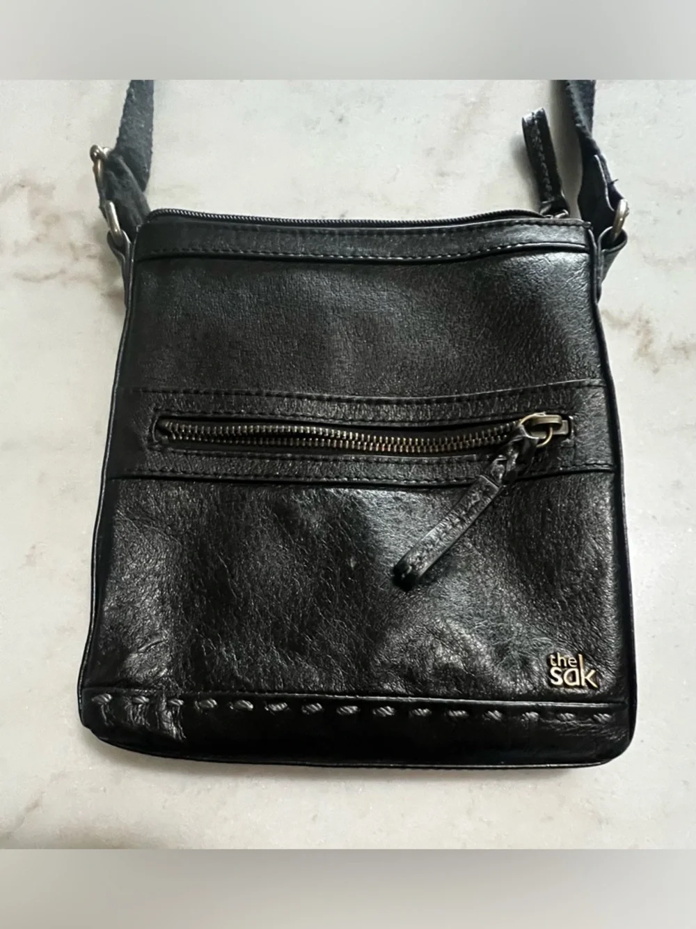 The Sak Black Leather Crossbody Bag with Gold Hardware And Colorful Lining